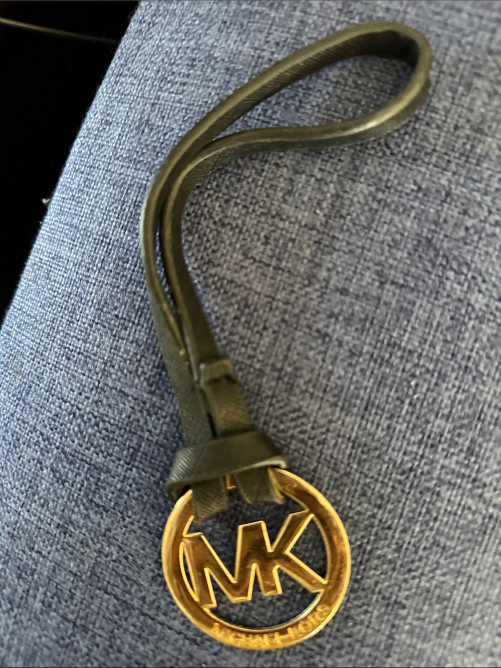 MK  Black Leather Wristlet Strap with Gold MK Charm